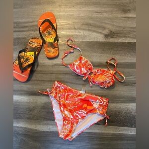 Multi color two piece swim wear. Fitted for a small size. Youth size.